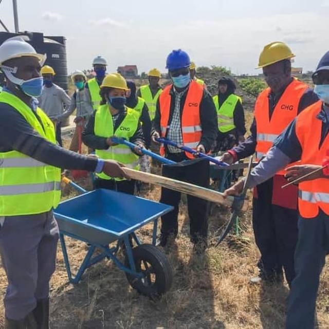 CHG team and MWAMKO builders on site