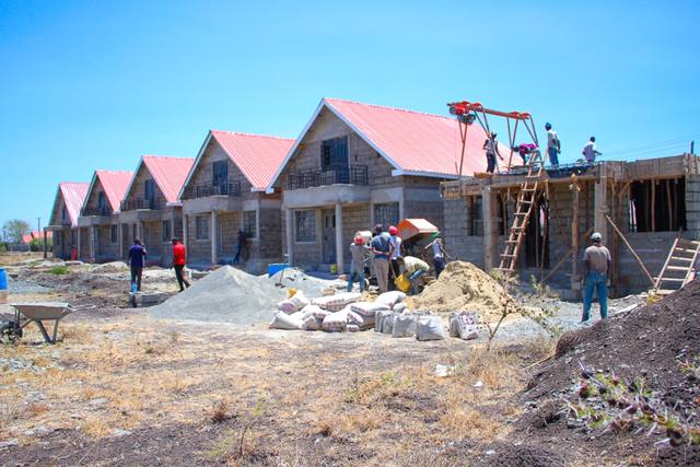 The first completed houses with the next house beginning beside them.